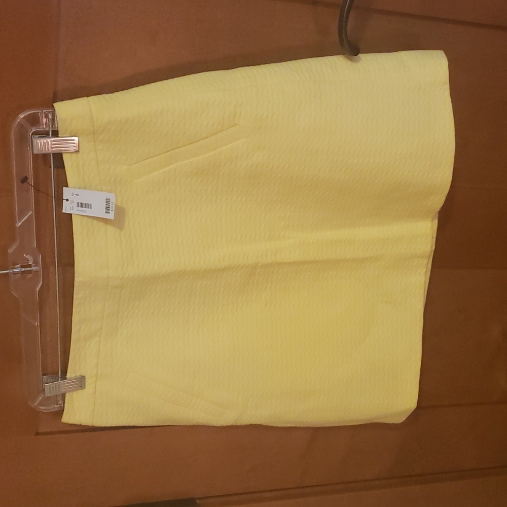 NWT Soft yellow mini skirt with back zipper